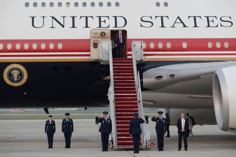 President Donald Trump walks down the stairs of Air Force One upon his arrival at Joint Base Andrews, Md., Sunday, July 19, 2026.