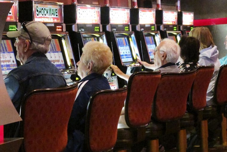 Part of a funding-related gambling agreement being worked on calls for creating up to 10 satellite casinos statewide, each with up to 700 slot machines and 100 table games. (AP Photo/Wayne Parry)