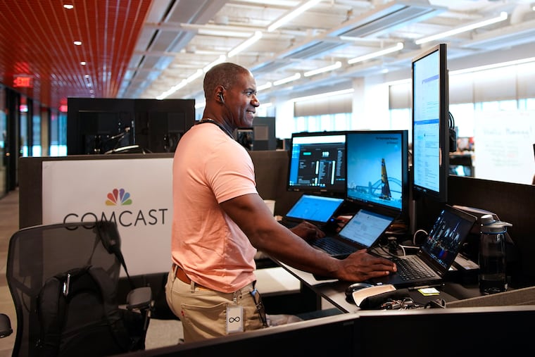 A Comcast engineer works at a sit-stand desk, provided by a company found through Comcast’s diverse supplier initiatives, at the new Technology Center.