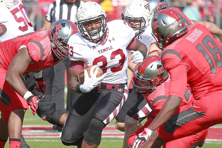 Temple running back Zaire Williams tries to elude (from left) Rutgers' Jamir Merrell, Kevin Snyder, and Jeremy Deering in the first quarter.