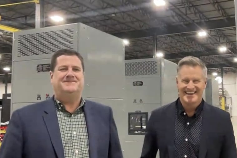 Robert Ricci (left), founder of DVM Manufacturing LLC, now known as DVM Power + Control, and Jeff Drees, chief executive of Texas-based Mission Critical Group, which bought West Chester-based DVM.