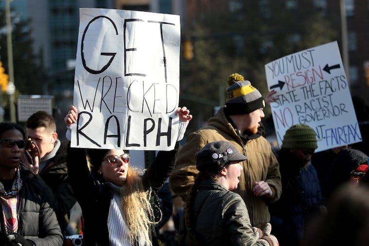 Protesters demanding his resignation gather outside the governor's mansion in Richmond, Va., on Saturday, Feb. 2, 2019, after a racist photo of Gov. Ralph Northam was found in his 1984 medical school yearbook.
