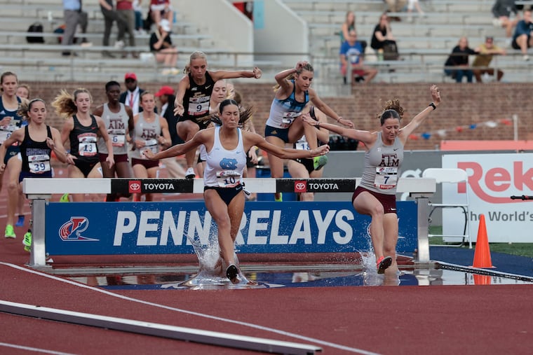 Runners, including North Carolina’s # 10 Sydney Masciarelli and Texas A&M’s # 7 Kennedy Fontenot, in the women’s 3000m Steeplechase Championship during the 129th running of the Penn Relays at Franklin Field in Philadelphia on Thursday, April 24, 2025.