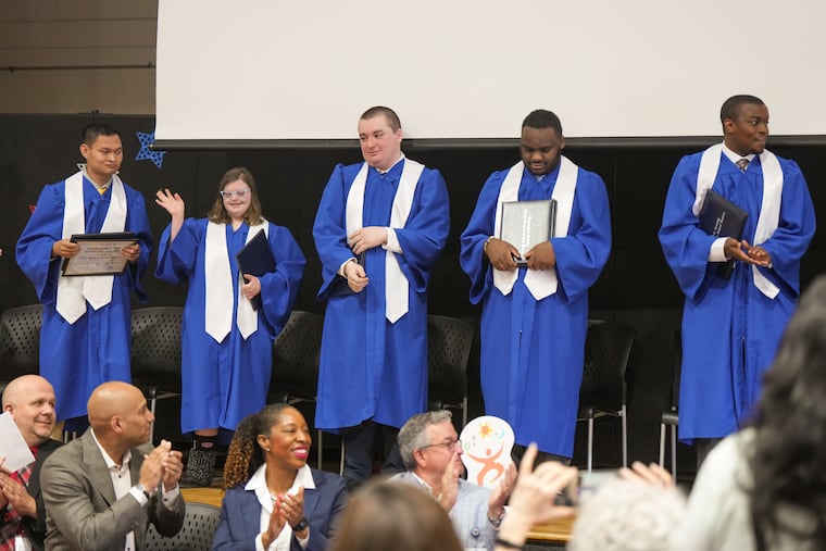 Tristian Villafuerte (from left), Grace Sullivan, Matthew Pettola, Myson Parham, and Kortu Lemu graduate from a new internship program at Virtua Health. The program helps prepare young people with special needs for jobs. The ceremony took place at the Burlington County Special Services Transitions Campus in Westampton, N.J.