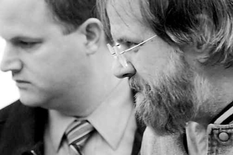 GARY EMEIGH / The (Wilmington) News Journal A Delaware State Police detective (left) escorts Earl Bradley in Georgetown, Del. Bradley, a pediatrician, is accused of 471 counts of molesting 103 children. In announcing the indictment last week, Delaware Attorney General Beau Biden said the number could increase as more alleged victims are identified.