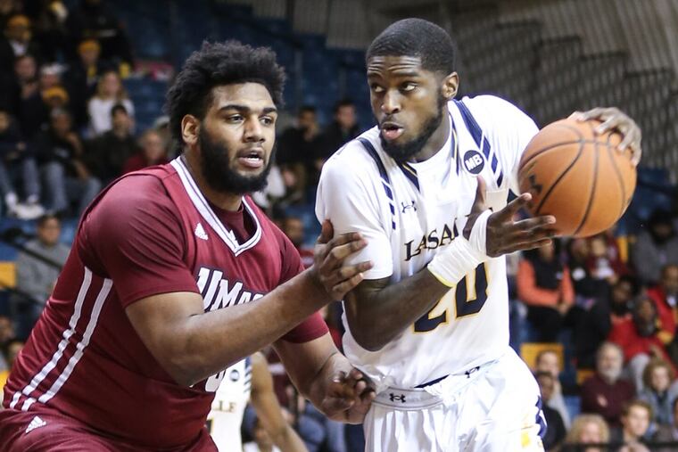 La Salle’s B.J. Johnson (right) returns this season after being the Explorers’ leading scorer last season.