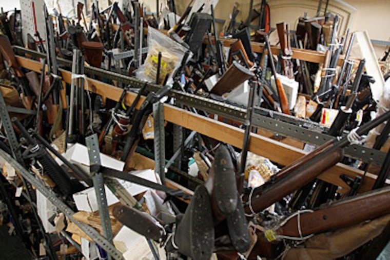 So many guns get confiscated that City Hall's evidence room can't hold them all; three other locations also store guns. (David Maialetti/Staff Photographer)