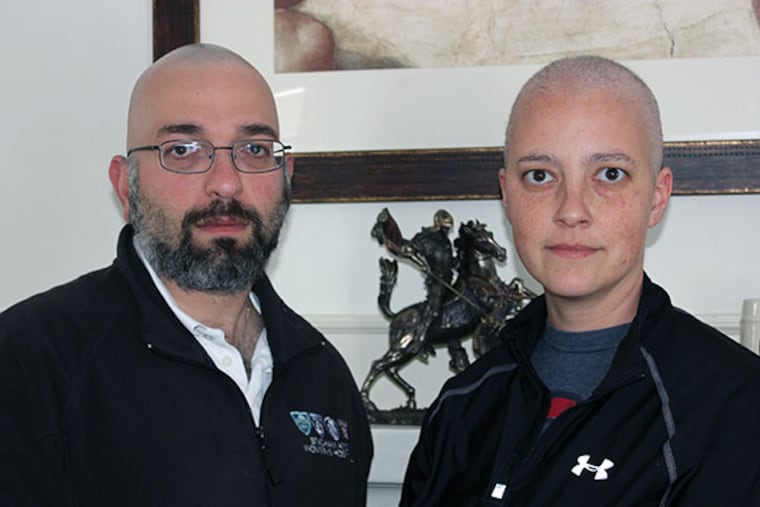 Anesthesiologist Amy Reed, who is fighting leiomyosarcoma, and her husband, surgeon Hooman Noorchashm, who shaved his head in solidarity with her. They are in their home in Boston. (Courtesy photo)