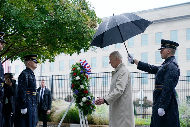President Joe Biden participates in a wreath laying ceremony while visiting the Pentagon in Washington, Sunday, Sept. 11, 2022, to honor and remember the victims of the September 11th terror attack.