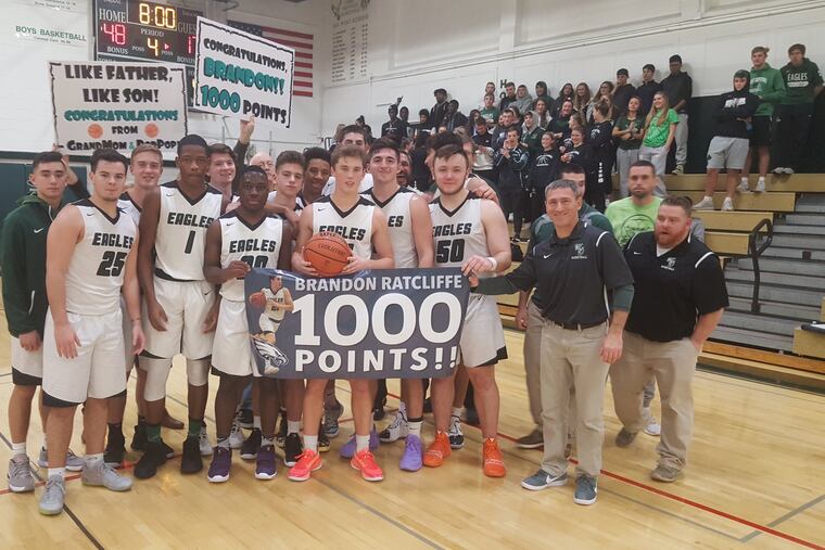 Brandon Ratcliffe is surrounded by teammates and coaches as he scored his 1,000th career point in West Deptford's 62-28 win over Audubon on Dec. 23, 2019.