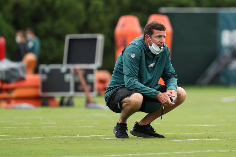 Dave Fipp, shown watching practice early last season, spent eight seasons running Eagles special teams.