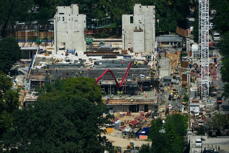 Workers continue construction on the new White House ballroom, as seen from the Washington Monument, Monday, Aug. 17, 2026, in Washington.
