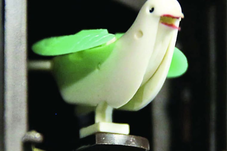 A cuckoo bird pops out of a quartz battery-operated cuckoo clock at Bill Galinsky's workshop in Waukesha, Wis. (MIKE DE SISTI / Milwaukee Journal Sentinel)
