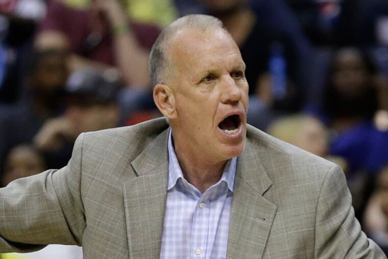 Doug Collins argues a call during the second half of an NBA basketball game on Friday, April 12, 2013, in Washington. (Evan Vucci/AP)