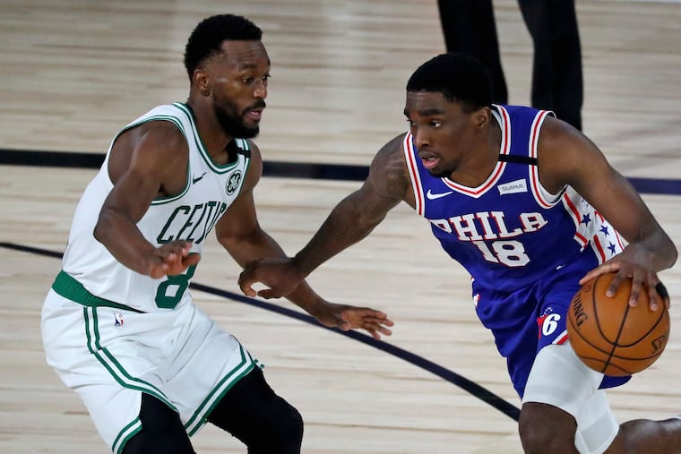 76ers guard Shake Milton drives with the ball around Celtics guard Kemba Walker in a recent game.