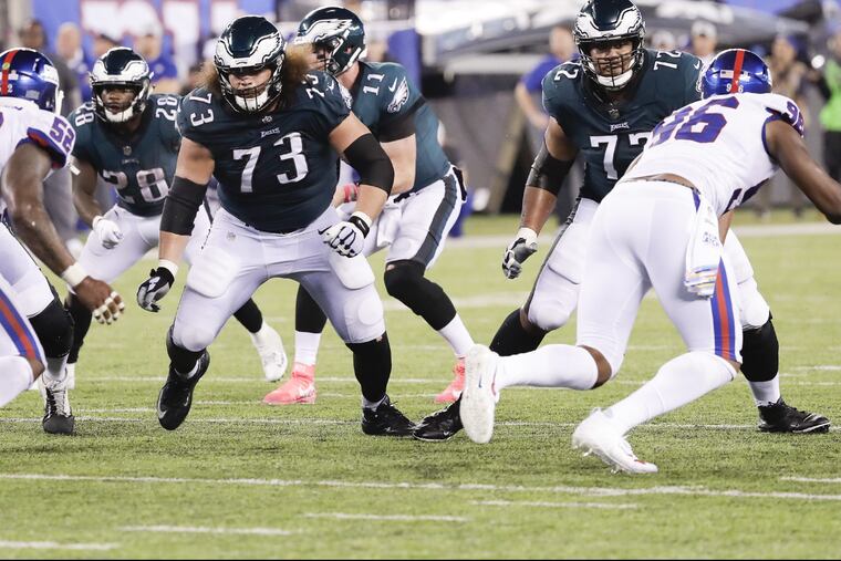 Eagles offensive guard Isaac Seumalo and Eagles offensive tackle Halapoulivaati Vaitai prepare to block New York Giants defenders on Thursday, October 11, 2018 in East Rutherford, NJ. YONG KIM / Staff Photographer