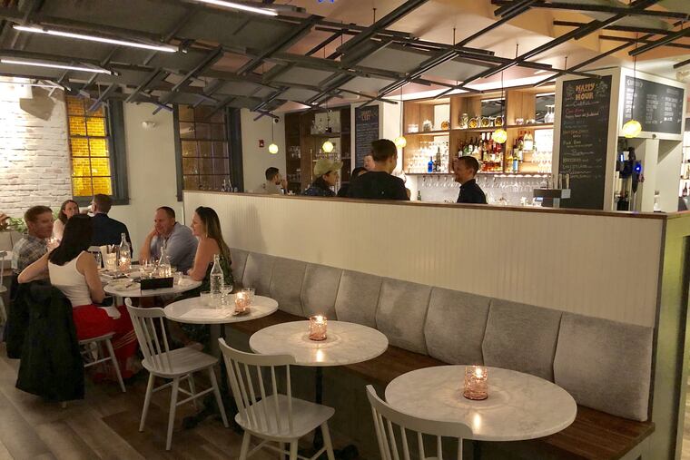 Bloomsday, 414 S. Second St., adapts a candlelit atmosphere at night.The bar is at rear, beyond the banquette seating.