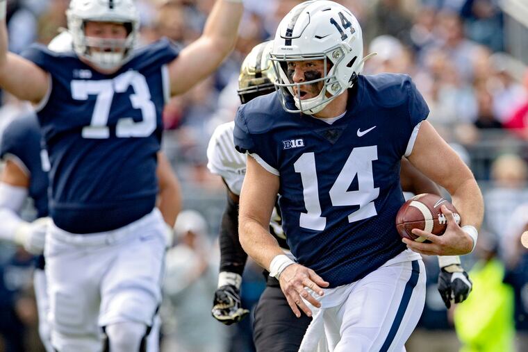 Penn State quarterback Sean Clifford (14) scores on a 3-yard touchdown run in the first quarter against Purdue on Saturday, Oct. 5, 2019, at Beaver Stadium in University Park, Pa. The host Nittany Lions won, 35-7. (Abby Drey/Centre Daily Times/TNS)
