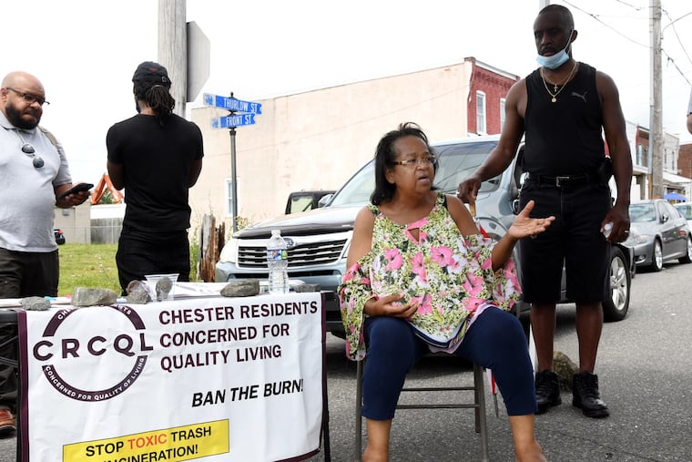 Zulene Mayfield (middle), founder of Chester Residents Concerned For Quality Living, speaks during a community meeting on Thurlow Street in Chester on June 26, 2021.