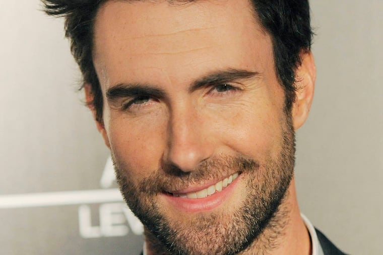 Singer Adam Levine poses at an event debuting his signature fragrances for men and women on Wednesday, Feb. 6, 2013 in Los Angeles. (Photo by Chris Pizzello/Invision/AP)