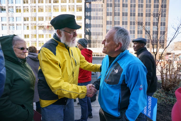 On Thursday, March 5, 2020, Dean Beer, right, former chief public defender in Montgomery County, was greeted by supporters after a protest on the steps of the Montgomery County Courthouse in Norristown about the recent firings of Beer and his deputy, Keisha Hudson.