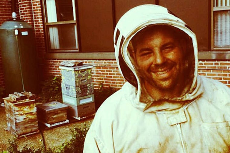 Don Shump, of the Philadelphia Bee Co., is suited up and ready to harvest honey from the hives at his West Parkside Apiary at the Philadelphia Business and Technology Center in West Philadelphia. (CRAIG LaBAN / Staff)
