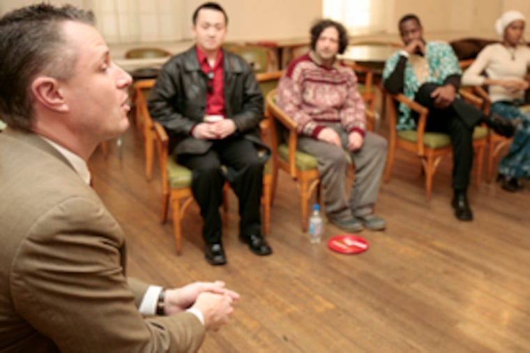 John G. Duesler Jr. (left) leads a discussion during the peace festival at the Philadelphia Ethical Society at Rittenhouse Square. He is chairman of Peace Action-Philadelphia, the sponsor.