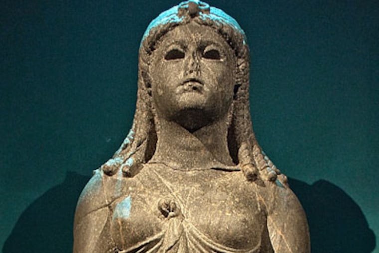 A black granite statue of a queen from the Ptolemaic period, most likely Cleopatra. (DAVID M WARREN / Staff Photographer)
