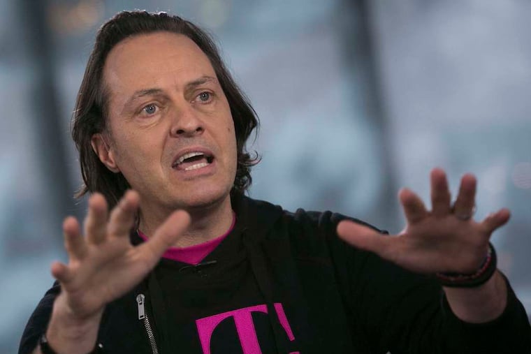 John Legere , T-Mobile CEO, also took shots at the "stupid, broken, arrogant industry." SCOTT EELLS / Bloomberg
