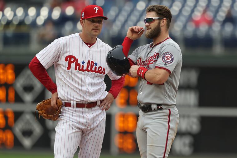 The Phillies, who have an opening in their outfield after moving Rhys Hoskins back to first base, will meet Bryce Harper Saturday in Las Vegas.