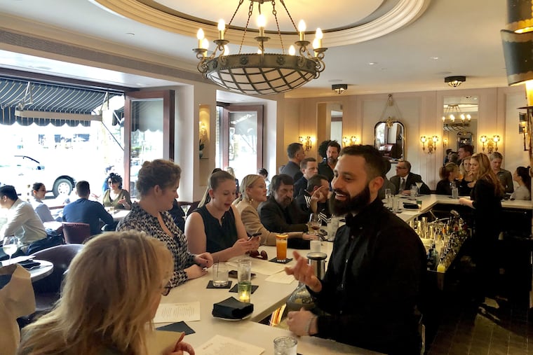 The chandelier over the bar is one element that designer Meg Rodgers incorporated into the redesign.