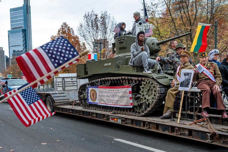 WWII veterans Benjamin Berry (left, seated at right) and Jake Ruser (right) are on a float with American Legion Post 405 in the tenth annual Philadelphia Veterans Parade on the Ben Franklin Parkway honoring all veterans.Sunday, Nov. 10, 2024. The parade for this year will be held on Nov. 9.