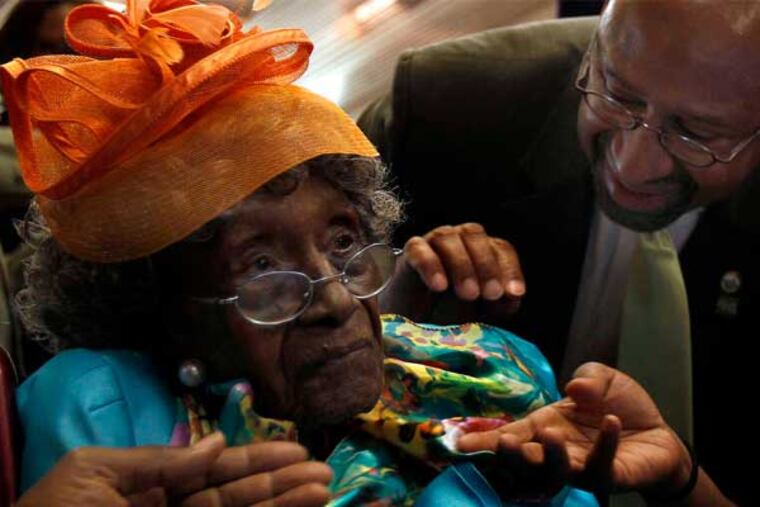 Mayor Nutter greets Anna Henderson, who's 58 years his senior, yesterday at an event in City Hall honoring Philadelphia's oldest citizens. At 113, Henderson is also the sixth-oldest American. (David Maialetti / Staff Photographer)