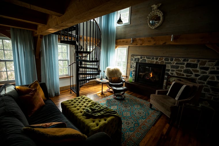 The Timber Frame Room, an addition built by Amish carpenters in 2012, features a circular iron staircase.