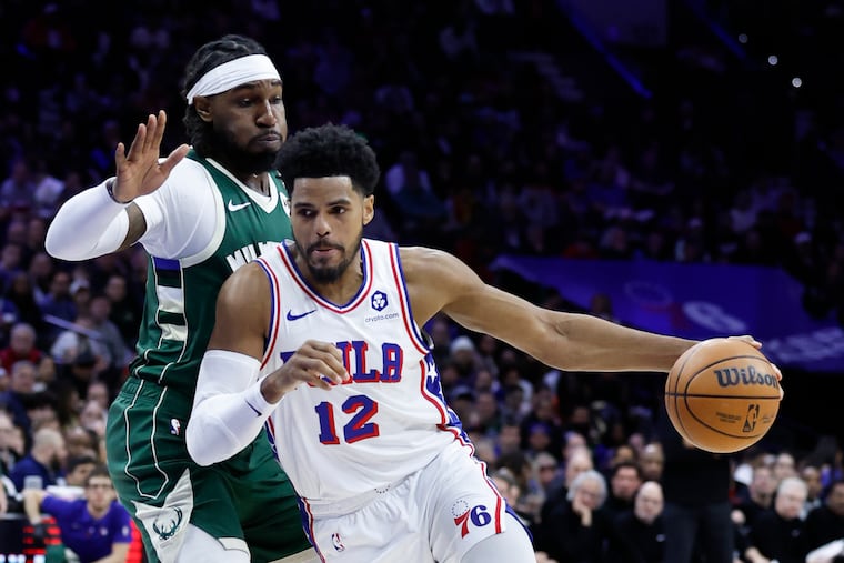 Sixers forward Tobias Harris dribbles the basketball against Milwaukee Bucks forward Jae Crowder on Sunday, February 25, 2024 in Philadelphia.