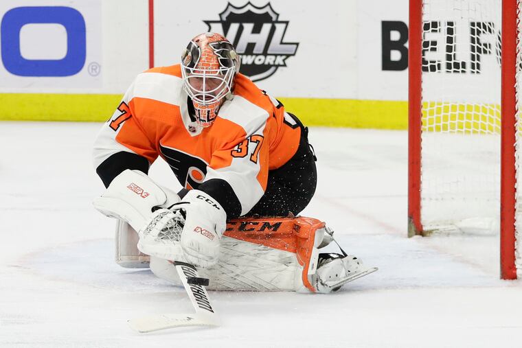 Flyers goaltender Brian Elliott stops the puck against the New Jersey Devils on Feb. 6.