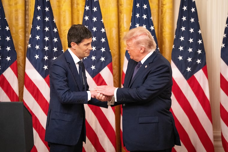 President Donald Trump talks with Kevin Warsh after he was sworn in as chairman of the Federal Reserve Board of Governors at the White House.