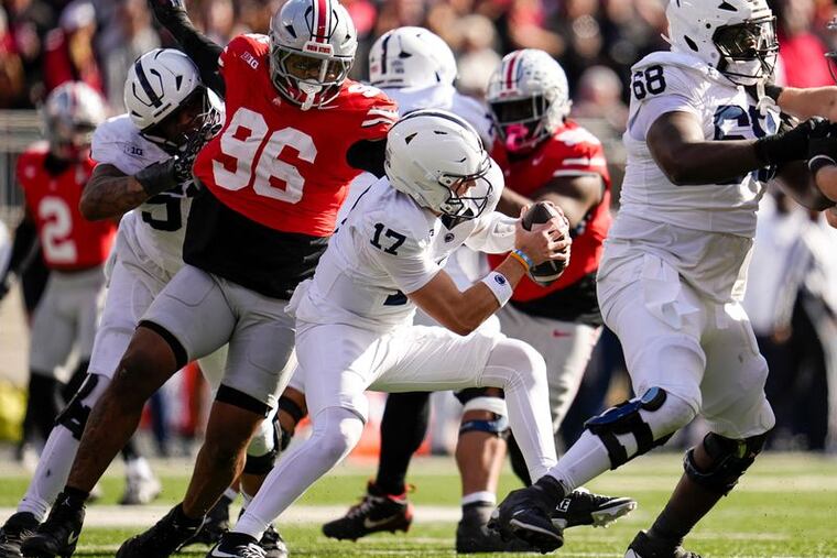 Ohio State defensive end Eddrick Houston (96) puts the pressure on Penn State Nittany quarterback Ethan Grunkemeyer (17) in Saturday's game at Ohio Stadium.