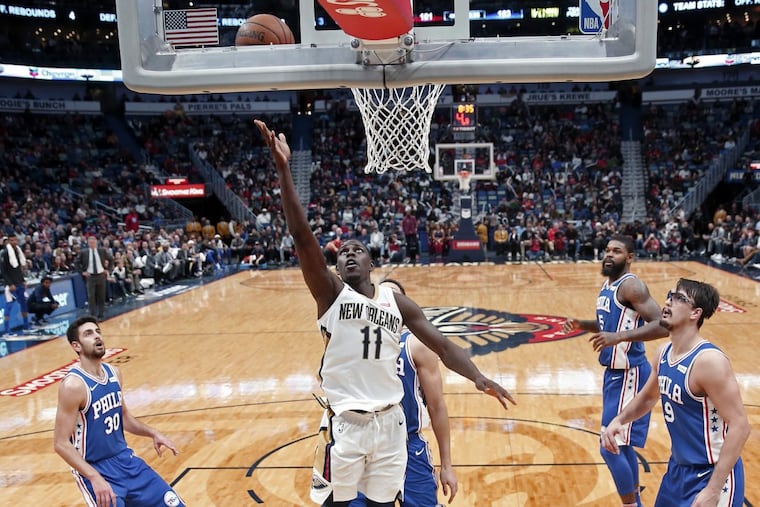 New Orleans Pelicans guard Jrue Holiday (11) goes to the basket in the second half against the Philadelphia 76ers.