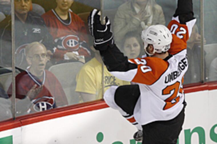 The Flyers' R.J. Umberger faces the crowd as he celebrates his goal against the Canadiens during the first period of Game 5 in the Eastern Conference semifinals. (AP Photo/The Canadian Press, Paul Chiasson)
