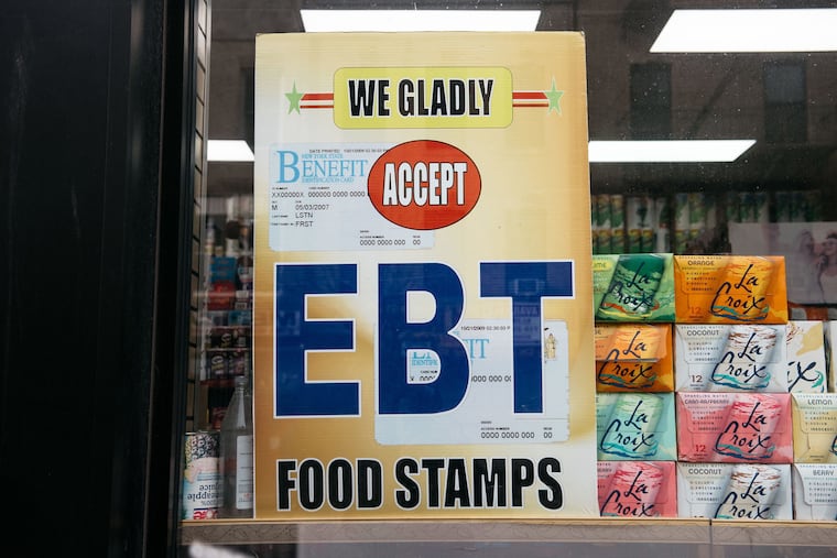 A sign alerting customers about food stamps benefits is displayed at a Brooklyn grocery store in New York City in 2019.