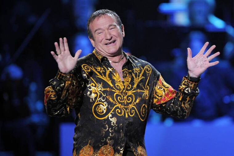 FILE - This April 6, 2008 file photo shows actor-comedian Robin Williams speaks on stage at the "Idol Gives Back" fundraising special of "American Idol" in Los Angeles. Williams, whose free-form comedy and adept impressions dazzled audiences for decades, has died in an apparent suicide. He was 63. The Marin County Sheriff’s Office said Williams was pronounced dead at his home in California on Monday, Aug. 11, 2014. The sheriff’s office said a preliminary investigation showed the cause of death to be a suicide due to asphyxia. (AP Photo/Mark J. Terrill, File)