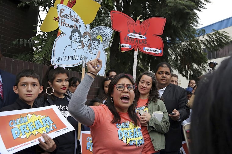 Cristina Jimenez speaks to demonstrators, urging the Democrats to protect the Deferred Action for Childhood Arrivals (DACA) program, during a rally outside the office of California Democratic Sen. Dianne Feinstein in Los Angeles, Wednesday, Jan. 3, 2018.