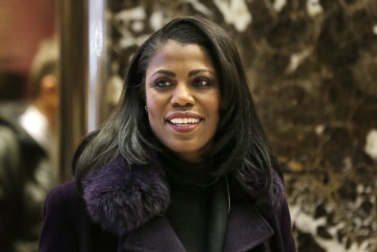In this Dec. 13, 2016 file photo, Omarosa Manigault smiles at reporters as she walks through the lobby of Trump Tower in New York. The White House says Omarosa Manigault Newman, one of President Donald Trump’s most prominent African-American supporters, plans to leave the administration next month.