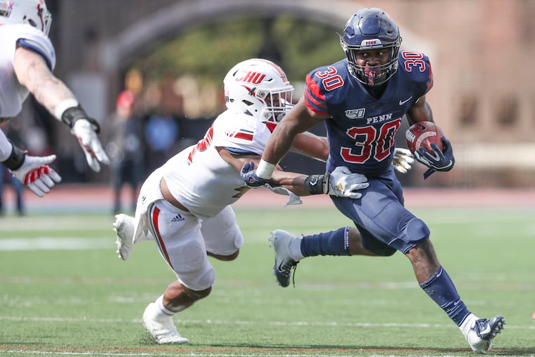 Penn running back Karekin Brooks (30) runs the ball in the first quarter against Sacred Heart.