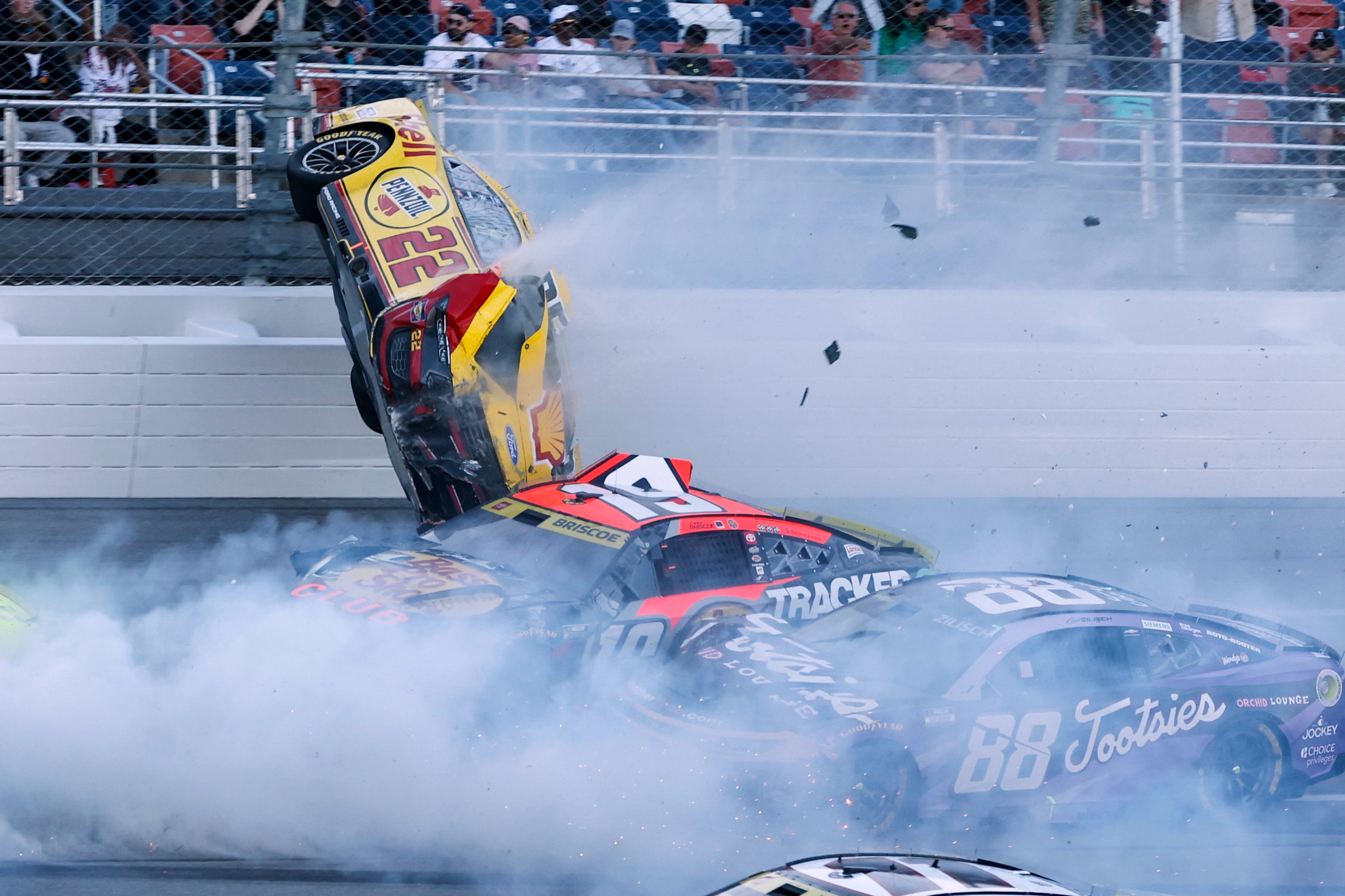NASCAR race at Talladega stopped after Joey Logano's car goes airborne in scary 15-car wreck