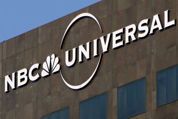 FILE - This Dec. 3, 2009, file photo, the NBC Universal logo hangs on a building in Los Angeles. (AP Photo/Jae C. Hong, File)