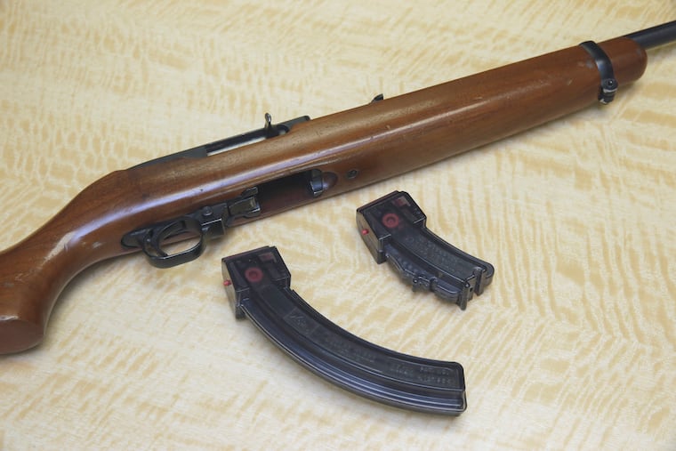FILE - In this June 27, 2017 photo, a semi-automatic rifle is displayed with a 25 shot magazine, left, and a 10 shot magazine, right, at a gun store in Elk Grove, Calif. A federal judge on Friday, April 5, 2019, halted sales of high-capacity ammunition magazines in California, giving state officials a chance to appeal his order last week that allowed their sale for the first time in nearly 20 years. U.S. District Judge Roger Benitez barred further sales until the 9th U.S. Circuit Court of Appeals considers whether to reinstate the state's ban on magazines holding more than 10 bullets. (AP Photo/Rich Pedroncelli, File)