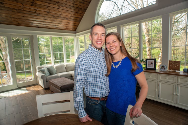 Andrew and Emily Buschmeier wanted to enjoy the nearby woods, but mosquitos were a problem. Their new sunroom, filled with windows, has a stained pine ceiling and a heated, wood-patterned floor.