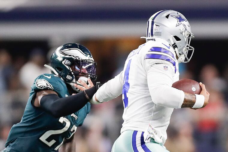 Dallas Cowboys quarterback Dak Prescott runs with the football against Eagles strong safety Malcolm Jenkins during the third-quarter on Sunday, October 20, 2019 in Arlington, TX.